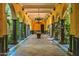 Covered patio with arched columns, stone flooring and a chandelier at 8100 N 68Th St, Paradise Valley, AZ 85253