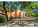 Spanish-style home with large wooden doors and lush landscaping at 8100 N 68Th St, Paradise Valley, AZ 85253