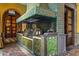 Detailed outdoor kitchen with tile work and stainless steel appliances at 8100 N 68Th St, Paradise Valley, AZ 85253
