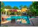 Relaxing pool area with patio chairs and lush landscaping at 8100 N 68Th St, Paradise Valley, AZ 85253