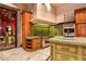 Gourmet kitchen with green granite counters and custom cabinetry at 8100 N 68Th St, Paradise Valley, AZ 85253