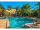 Spacious pool with a patio chair and lush greenery at 8100 N 68Th St, Paradise Valley, AZ 85253