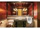 Bathroom with dark wood cabinets and urinal at 8100 N 68Th St, Paradise Valley, AZ 85253