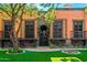 Exterior view of building with lush landscaping and courtyard at 8100 N 68Th St, Paradise Valley, AZ 85253