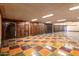 Large garage featuring tiled floors and multiple wood doors at 8100 N 68Th St, Paradise Valley, AZ 85253