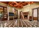 Bright living room with a fireplace and access to the backyard at 8100 N 68Th St, Paradise Valley, AZ 85253