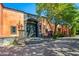 Spanish-style home with large wooden doors and lush landscaping at 8100 N 68Th St, Paradise Valley, AZ 85253