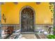 Elegant exterior entry with custom wood doors and tile accents at 8100 N 68Th St, Paradise Valley, AZ 85253