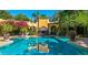 Large rectangular pool with a fireplace and lush greenery at 8100 N 68Th St, Paradise Valley, AZ 85253