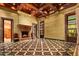 Elegant living room with fireplace, high ceilings, and intricate tile floors at 8100 N 68Th St, Paradise Valley, AZ 85253