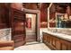 Elegant bathroom with marble vanity and rich wood accents at 8100 N 68Th St, Paradise Valley, AZ 85253