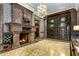 Elegant fireplace with ornate mantel in a grand entryway at 8100 N 68Th St, Paradise Valley, AZ 85253