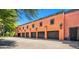 Five-car garage with dark wood doors and terracotta pavers at 8100 N 68Th St, Paradise Valley, AZ 85253