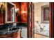 Upscale bathroom featuring dark wood cabinetry and granite countertop at 8100 N 68Th St, Paradise Valley, AZ 85253