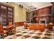 Elegant living room features a fireplace, spiral staircase, and intricate wood detailing at 8100 N 68Th St, Paradise Valley, AZ 85253