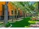 Landscaped backyard with lush green lawn and patio areas at 8100 N 68Th St, Paradise Valley, AZ 85253