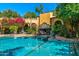 Stunning pool area with a fireplace and beautiful landscaping at 8100 N 68Th St, Paradise Valley, AZ 85253