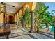 Lush courtyard view from covered patio with arched entryway at 8100 N 68Th St, Paradise Valley, AZ 85253
