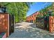 Grand estate with gated entry and expansive paved driveway at 8100 N 68Th St, Paradise Valley, AZ 85253
