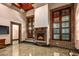 Living room with fireplace, hardwood floors, and large windows at 8100 N 68Th St, Paradise Valley, AZ 85253