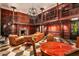 Two-story library with wood paneling, fireplace, and seating at 8100 N 68Th St, Paradise Valley, AZ 85253