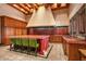 Large kitchen island with red cabinetry and high-end appliances at 8100 N 68Th St, Paradise Valley, AZ 85253