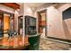 Small breakfast room with dark wood table and leather chairs at 8100 N 68Th St, Paradise Valley, AZ 85253
