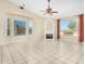 Living room with fireplace and large windows at 8310 E Greenview Dr, Gold Canyon, AZ 85118