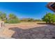 Flagstone patio with mountain views and built-in BBQ at 8310 E Greenview Dr, Gold Canyon, AZ 85118