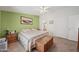Spacious main bedroom with king bed and access to bathroom at 50910 W Long Rifle Rd, Aguila, AZ 85320