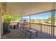 Covered patio with seating and backyard view at 50910 W Long Rifle Rd, Aguila, AZ 85320