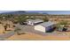 Aerial view of two houses and desert landscape at 50910 W Long Rifle Rd, Aguila, AZ 85320