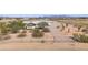 Ranch-style home with fenced yard and desert landscaping at 50910 W Long Rifle Rd, Aguila, AZ 85320