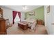 Main bedroom with king-size bed, rocking chair, and wood dresser at 50910 W Long Rifle Rd, Aguila, AZ 85320
