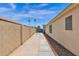 Long side yard with concrete path and gravel at 8148 W Hammond Ln, Phoenix, AZ 85043