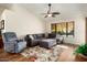 Relaxing living room with sectional sofa, recliner, and area rug at 14159 W Yosemite Dr, Sun City West, AZ 85375