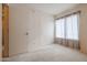 Well-lit bedroom with large windows and carpet flooring at 18116 N Catherine Dr, Surprise, AZ 85374