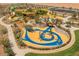 Modern playground with unique climbing structures and play areas at 1042 W Ridge Rd, Apache Junction, AZ 85120