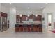 Modern kitchen with large island and dark wood cabinets at 7325 E Paraiso Dr, Scottsdale, AZ 85255