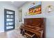 Elegant entryway with piano and hardwood floors at 17795 E Stocking Trl, Rio Verde, AZ 85263