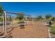 Playground area with tire swing and climbing at 11129 E Ulysses Ave, Mesa, AZ 85212