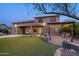 Expansive backyard with pergola, artificial turf, and patio at 2716 W Adventure Dr, Anthem, AZ 85086