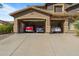 Three-car garage with ample space for vehicles and storage at 2716 W Adventure Dr, Anthem, AZ 85086