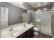 Bathroom with double sinks, shower, and tile floors at 1695 E Mia Ln, Gilbert, AZ 85298