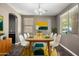 Bright dining room featuring a mid-century modern dining set and stylish decor at 1695 E Mia Ln, Gilbert, AZ 85298