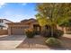 Charming single-story home with a well-maintained front yard and attractive landscaping at 1695 E Mia Ln, Gilbert, AZ 85298