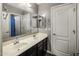 Bathroom with double sinks and a large mirror at 1695 E Mia Ln, Gilbert, AZ 85298