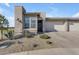 Single-story home with a two-car garage and desert landscaping at 35300 N Sunset Trl, Queen Creek, AZ 85140