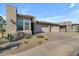 Modern stucco home with 2-car garage and desert landscaping at 35300 N Sunset Trl, Queen Creek, AZ 85140