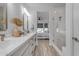 Elegant bathroom with dual sinks, a large mirror, and a glass-enclosed shower at 35300 N Sunset Trl, Queen Creek, AZ 85140